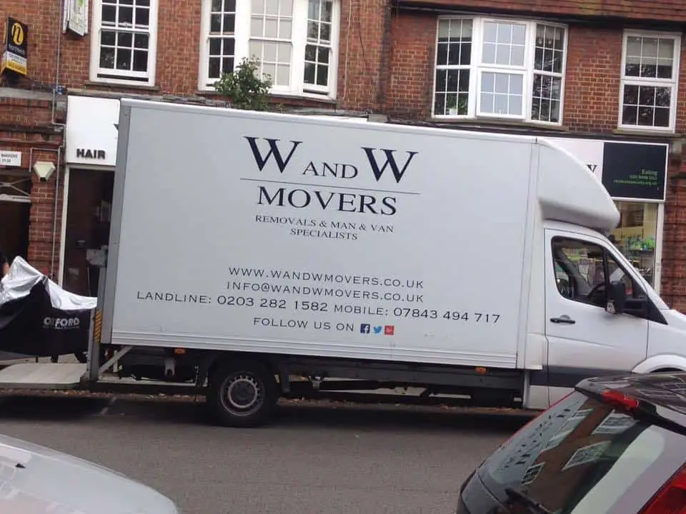 W & W Movers branded removal van parked on a city street