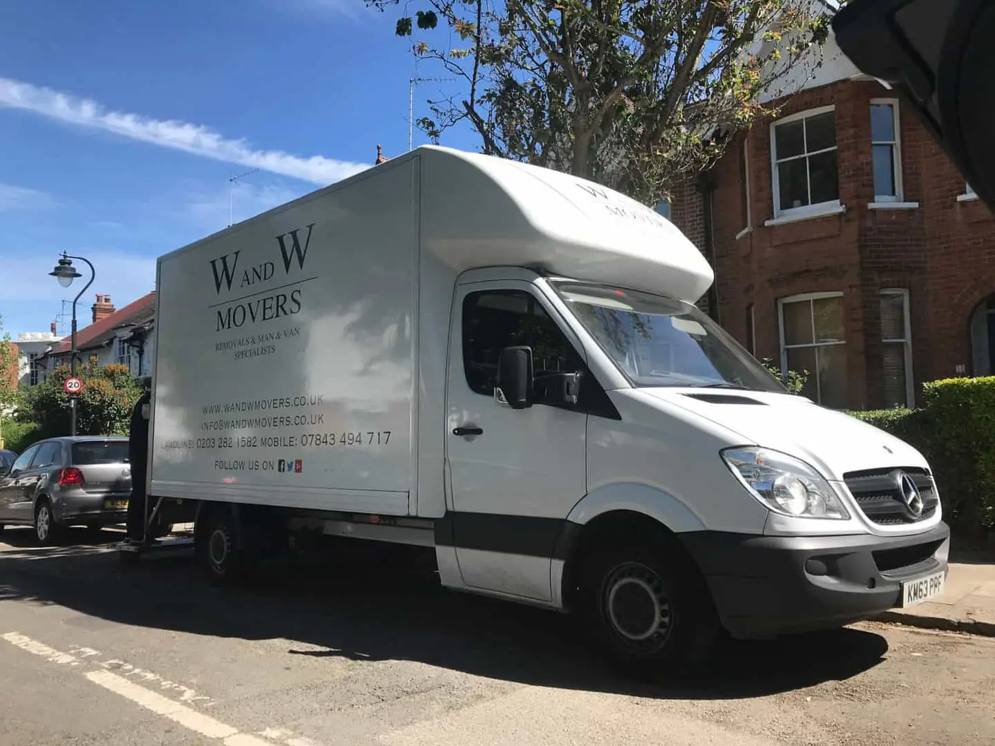 W&W Movers van parked on a residential London street