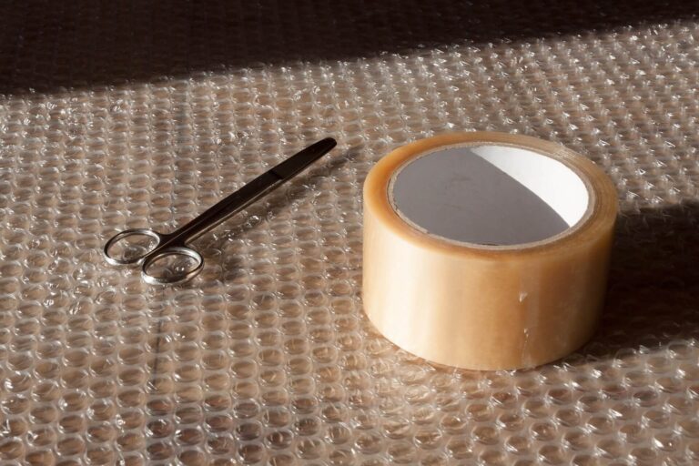 Bubble wrap for packaging with tape and scissors